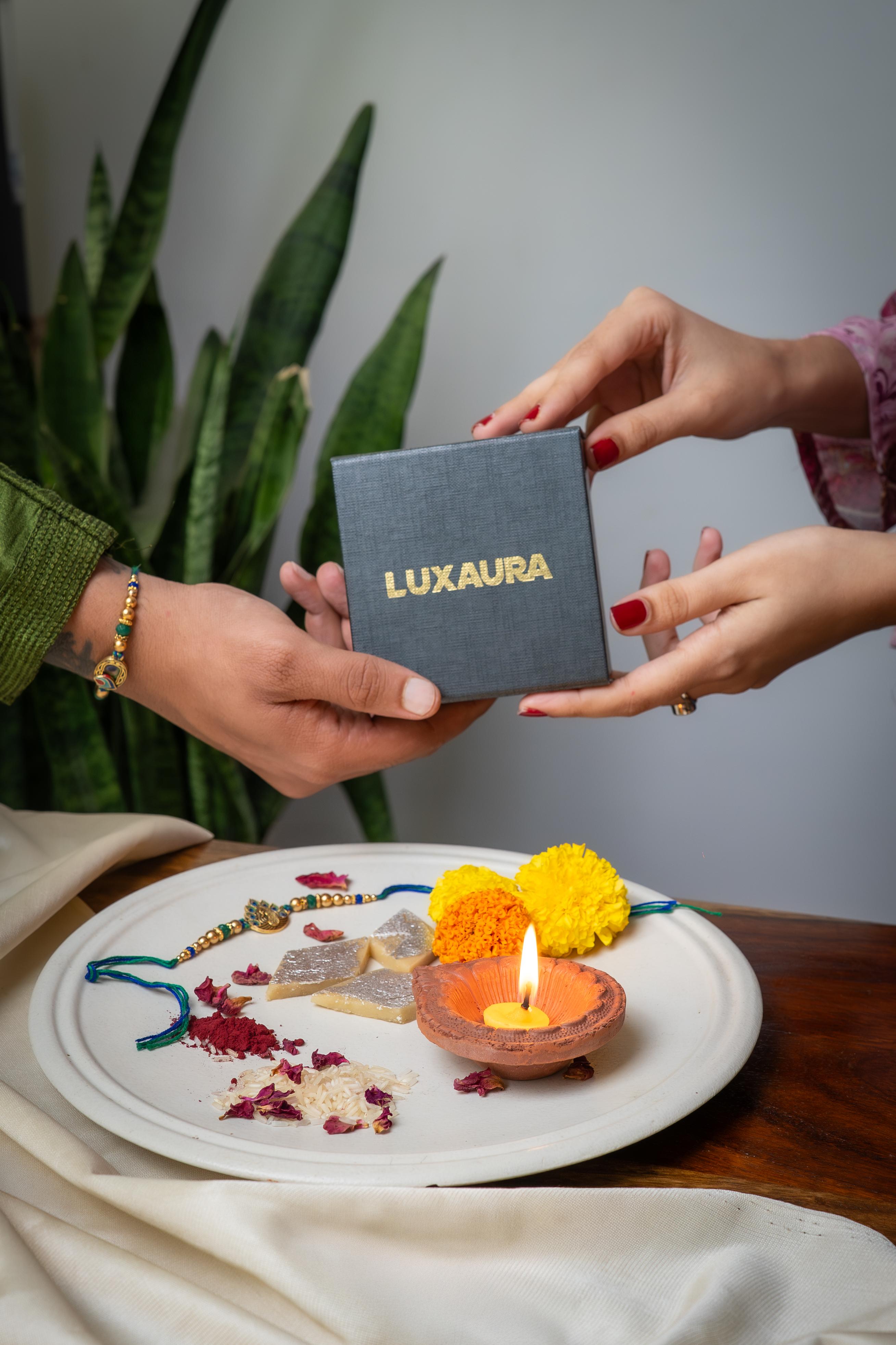Celebrate the bond of love with thoughtfully curated Rakhi hampers from Luxaura.